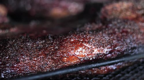 Seasoned Meat on a Grill Cooking Close Up