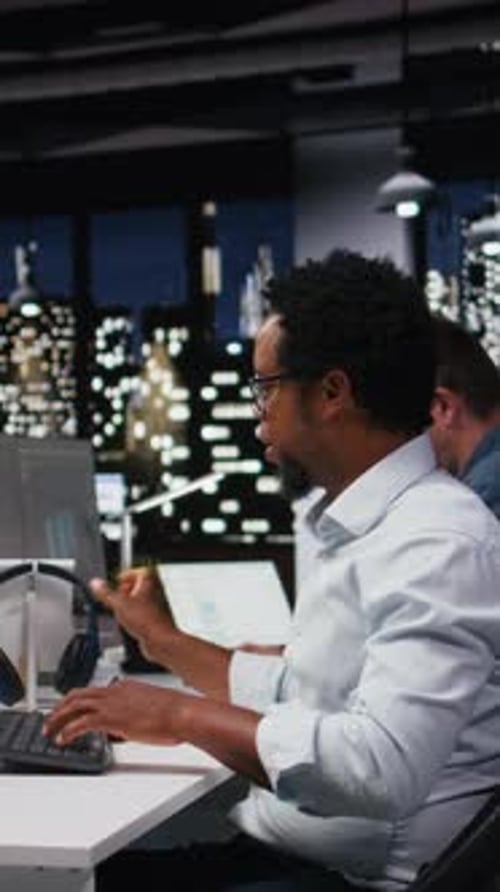 Vertical Video Tech Startup IT Specialist Developing AI Algorithms in Office Listening Music