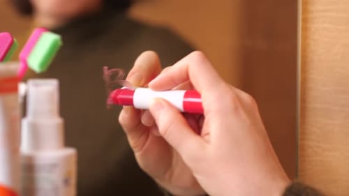 a Girl Writes the Word Bye with Red Lipstick Relationship Breakup Concept