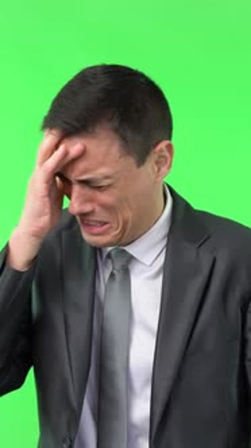 Crying Man in Formal Suit Against Chroma Key