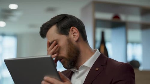 Worried ceo face palming in lobby thinking about project failure