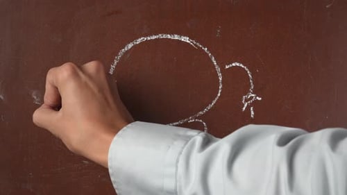 Drawing Imaginary Monster with Chalk on Surface