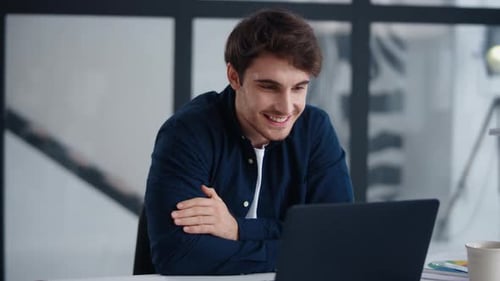 Closeup Handsome Business Man Looking Computer Screen in Office. Smiling Businessman Getting