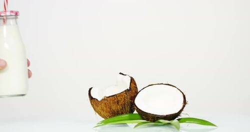 Fresh nourishing coconut milk moisturizing cream for hands, face and skin isolated on a white back