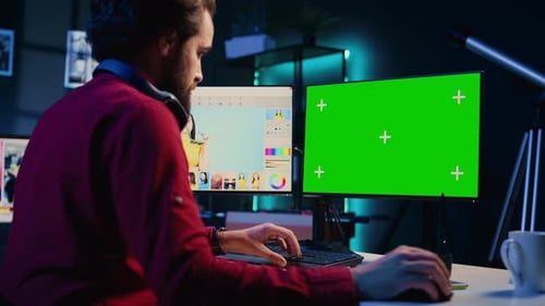 Photographer Enhancing Images Quality Using Green Screen Display Correcting Flaws