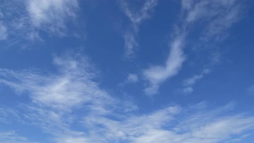 Clouds Flowing in a Clear Blue Sky