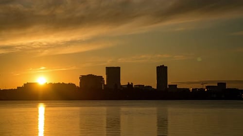 City skyline office buildings district time lapse at sunrise Bucharest , Romania
