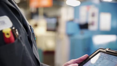 Machine Shop Worker Using Digital Tablet 5559 Years