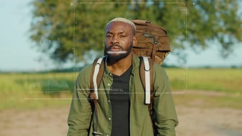 Smiling Young African American Man with Backpack 3D Identification Scan Information Look at Camera
