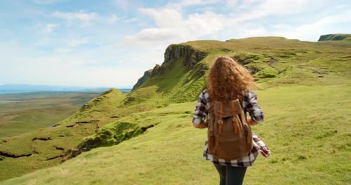 Woman, hiking and walking for travel nature, grass field or green mountains for adventure
