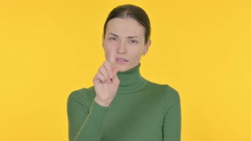Denying Beautiful Woman Rejecting Idea on Yellow Background