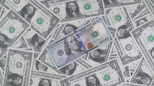 One Dollar Bill And One Hundred Dollar Bill.