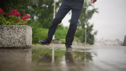 Walkway Splash Mood Rainy Journey with Reflective Mood Solitary Stride Under Rainy Overcast Sky
