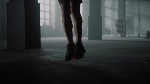 Closeup Unrecognizable Man Legs Jumping Skipping Rope in Sport Club. Professional Boxer