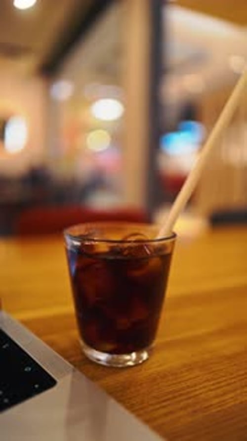 Refreshing Cold Drink in a Cozy Caf Setting
