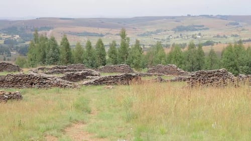 Panning of the camera showing an old construction formed with carefully placed rock walls