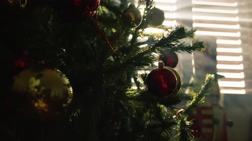 Christmas Tree Decorated with Gold and Red Ornaments