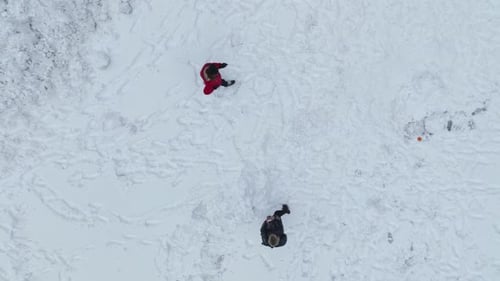 Snow Covered Trees and Snowy Forest on a Dark Cloudy Winter Day Top Down Drone Shot