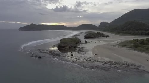 Aerial View of Tropical Coastline at Sunset