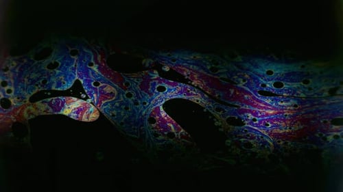 Abstract Multicolored Pattern Moving on Black Background