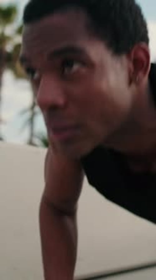 Young Adult Exercising Outdoors With Push-Ups