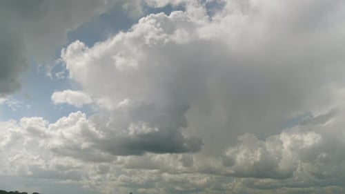 Clouds Drifting in a Blue Daytime Sky