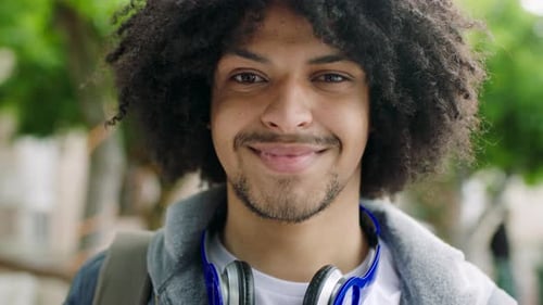 Smiling Young Adult with Headphones Close Up Portrait