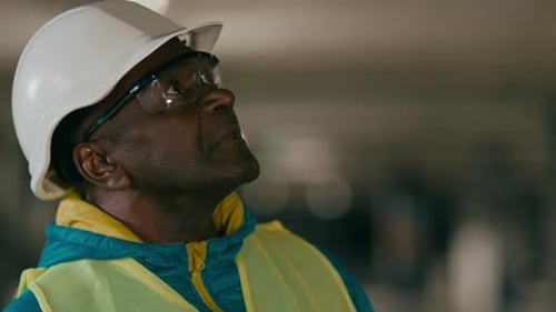 Closeup Mature Experienced Man Builder Engineer Developer Inspector in Uniform Protective Helmet