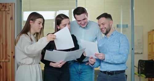 Young Team Working Collaboratively in Office