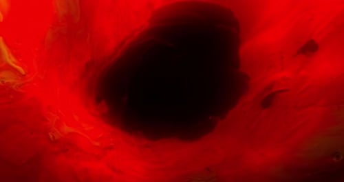 Pigment Of Red Paint In Motion On A Black Paint