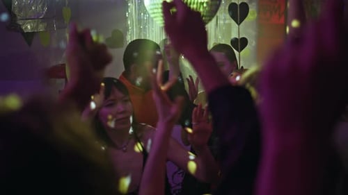Enthusiastic Young Adults Dancing at a Birthday Party