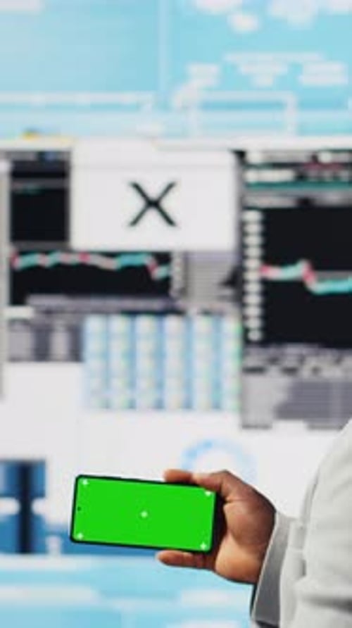 Vertical Video African American Business Leader Uses Green Screen Next to KPI Metrics
