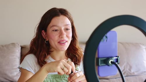 Young Beauty Vlogger Breaks Down Makeup Techniques for Followers