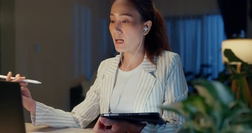 Professional Woman Working Remotely at Night