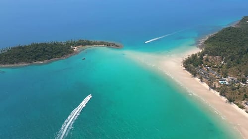 Aerial View of a Paradise White Sand Beach and Boats in Turquoise Sea Thailand