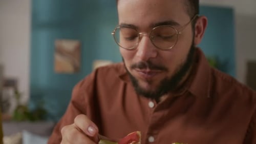 Man Eating Burger and Drinking Juice Close Up