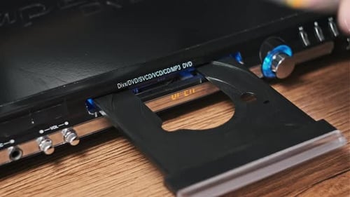 DVD Compact Disc is Inserted Into The Player