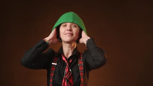 Fashionable Lesbian Adjusting Green Beanie a Bold Statement of LGBT Pride