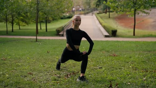 Woman Lunging in Park