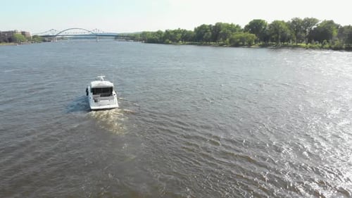 4k aerial footage of a boat enjoying the river