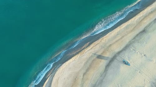 Calm Scene Of A Lonely Boat On The Beach Overhead