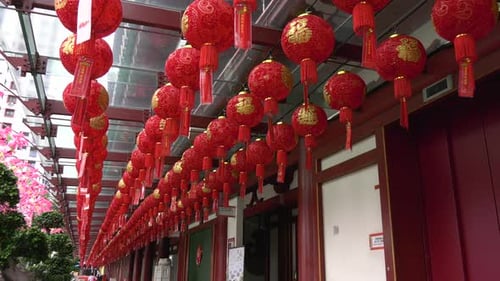 Hundreds of red lantern blowing in the summer breeze in a temple in Chinatown, Singapore
