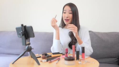 Beauty Influencer Reviews Lipstick for Online Tutorial