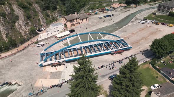 Bridge construction rigging process with large metal structure lifted ...