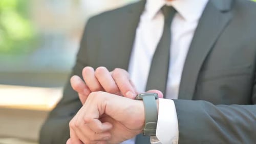 Close up of Businessman Using Smartwatch Outdoor