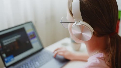 Teenage Girl Studying Online at Home
