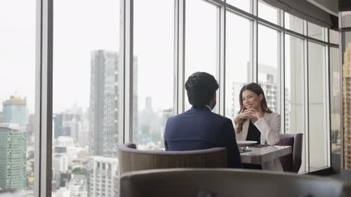 Couple have a meal at high floor tower.