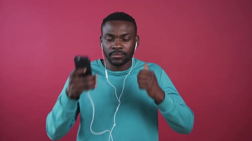 Man Listening to Music With Wired Earphones