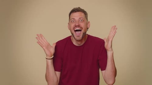Man Reacts with Surprise and Joy