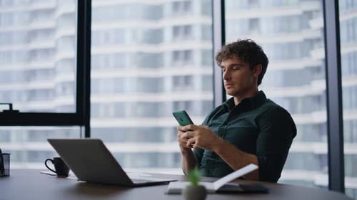 Stylish Ceo Reading Cellphone Message in Modern Office Smiling Businessman